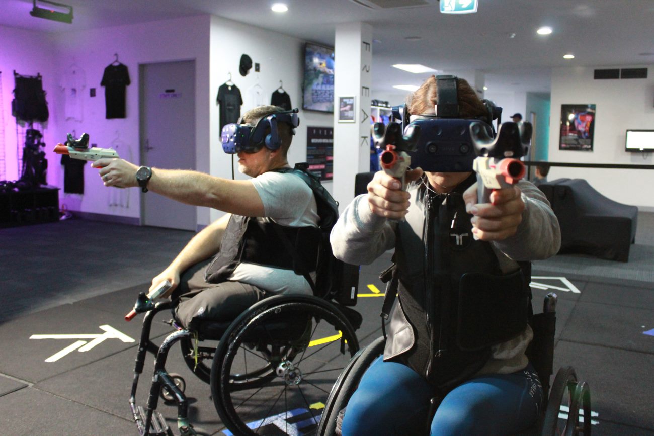 People in wheelchairs playing virtual reality